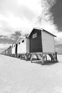 Lifeguard hut on beach against sky