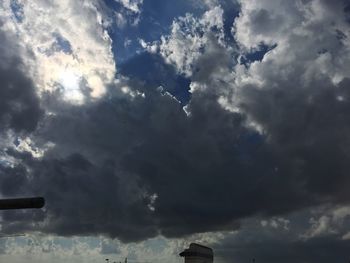 Low angle view of cloudy sky over clouds