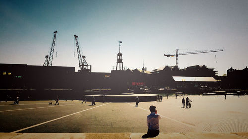 Silhouette people at construction site