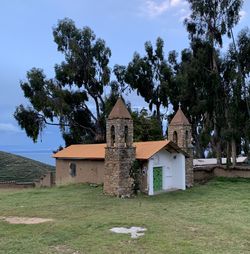 House on field against sky