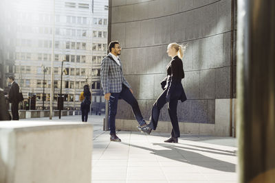 Side view of people walking in building