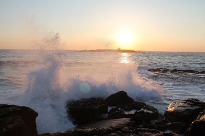 Scenic view of sea against sky during sunset