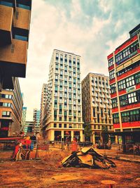 Low angle view of buildings against sky in city