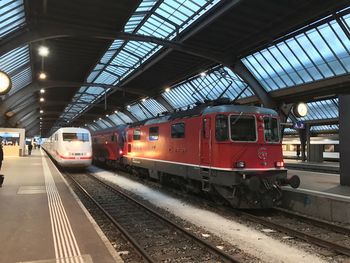 Train at railroad station against sky