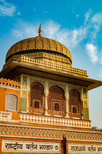 Pawan mahal in jaipur rajasthan with blue cloudy sky