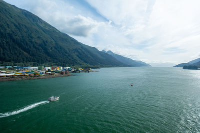 Small boat heading out of the gastineau channel near juneau, ak
