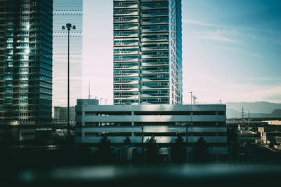 Modern buildings in city against sky
