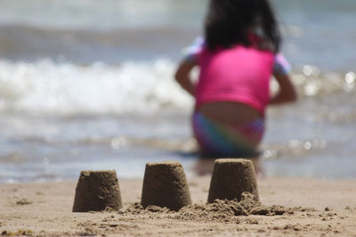 Rear view of woman on beach