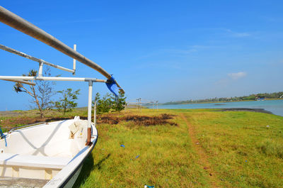 Scenic view of land against blue sky