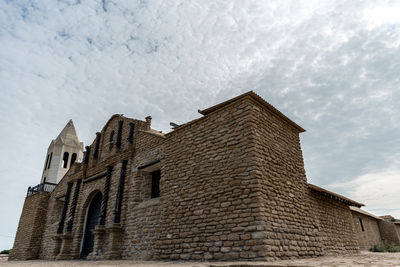 Low angle view of historic building against sky