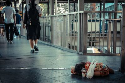 High angle view of homeless girl on bridge