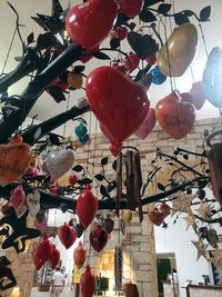 Low angle view of lanterns hanging on ceiling by building