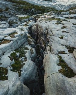 High angle view of rocks by river during winter