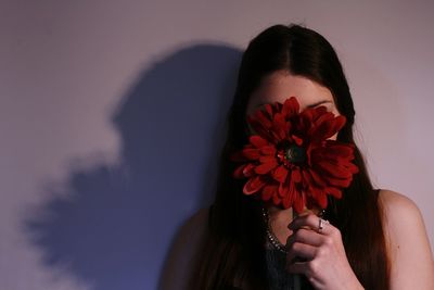 Close-up of hand holding flower