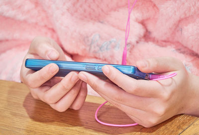 Midsection of woman using mobile phone