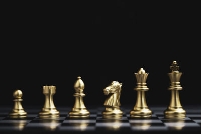 Full frame shot of chess pieces against black background
