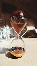 Close-up of clock on table