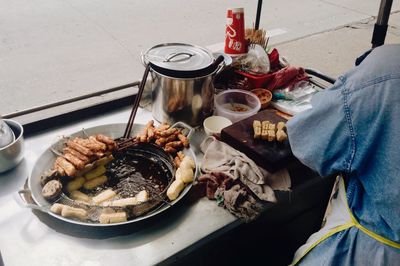 High angle view of man preparing food on street