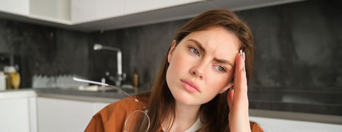 Portrait of young woman looking away