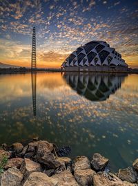 Scenic view of lake against sky during sunset