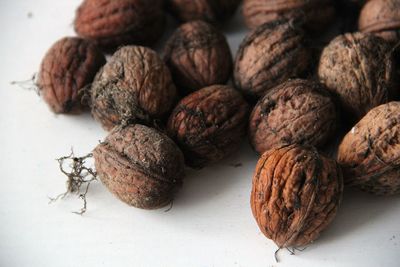 Close-up of fruits on table against white background