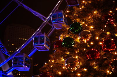 Illuminated christmas tree at night