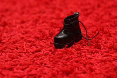 High angle view of black shoes on rug