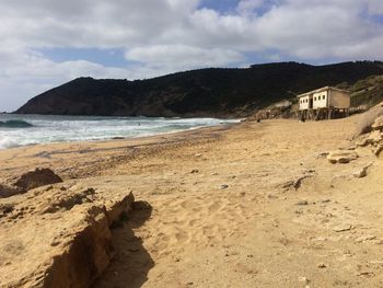 Scenic view of beach and sea against sky