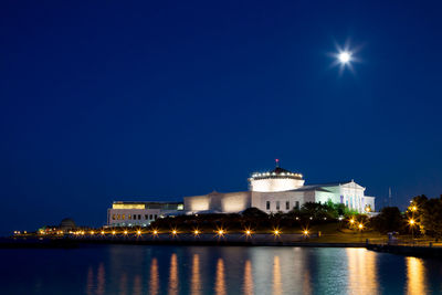 Illuminated buildings at waterfront