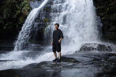 Full length of man standing on rock