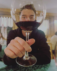 Portrait of man holding wineglass