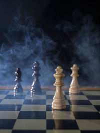 Close-up of chess pieces on table