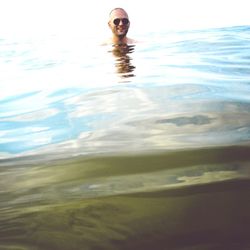 Portrait of young woman in water