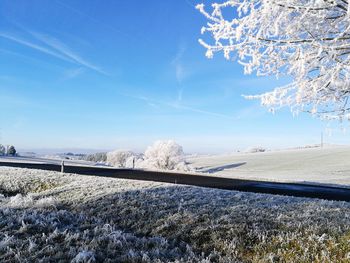 Scenic view of landscape against sky during winter