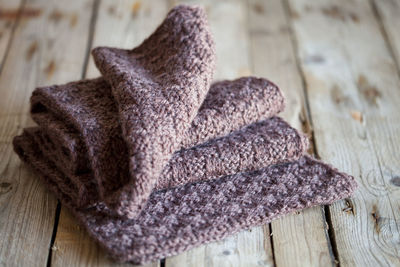 High angle view of brown woolen textile on wooden table