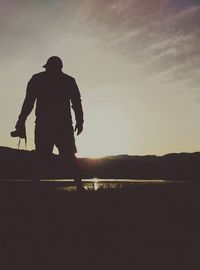 Silhouette of people at sunset