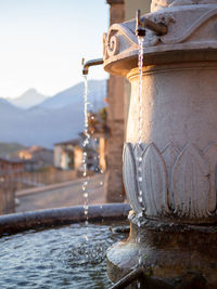 Close-up of fountain against water