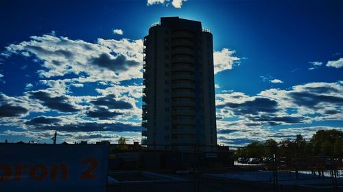 Low angle view of tower against cloudy sky