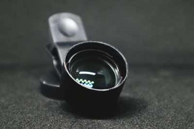 Close-up of camera on table
