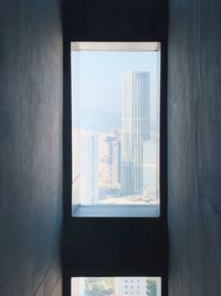 Modern buildings seen through window