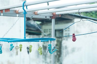 Close-up of clothespins hanging on clothesline