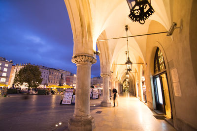 Low angle view of illuminated buildings against sky in city