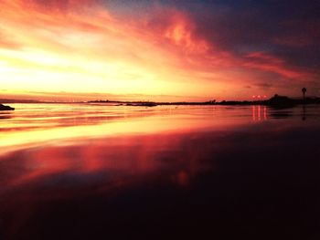 Scenic view of sea against romantic sky at sunset
