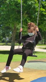 Girl swinging in the park 