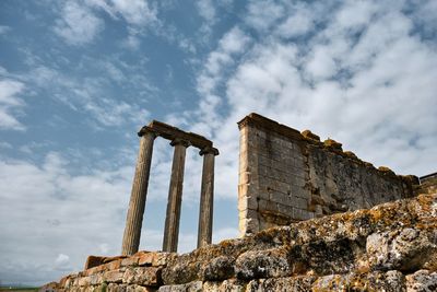 Low angle view of old ruins against sky