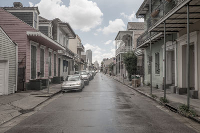 Vehicles on road along buildings