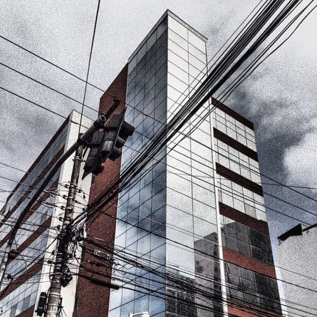 architecture, built structure, building exterior, low angle view, glass - material, modern, reflection, building, window, office building, city, day, glass, no people, outdoors, pattern, architectural feature, transparent, tall - high, wall - building feature