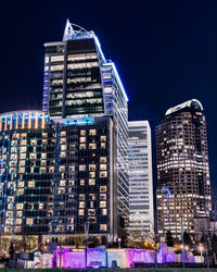 Illuminated buildings in city at night