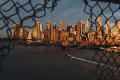 View of modern buildings in city at waterfront