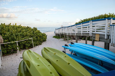 Kayaks along the sand at clam pass beach in naples, florida
